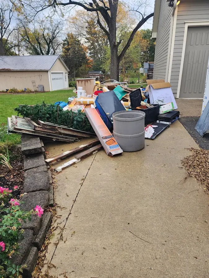 Dumpster being loaded with debris for Roofing Dumpster Rental in Coal